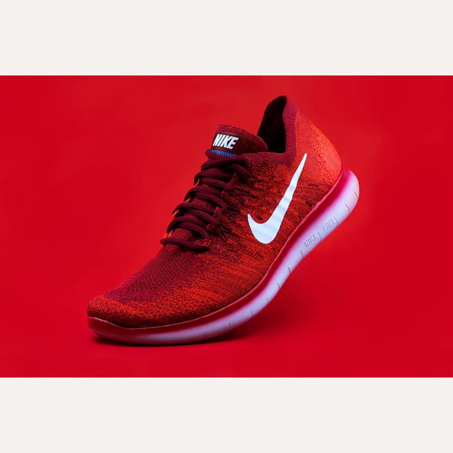 Full sneaker photo with a light background added above and below